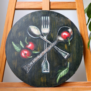 round still life silverware and cherries